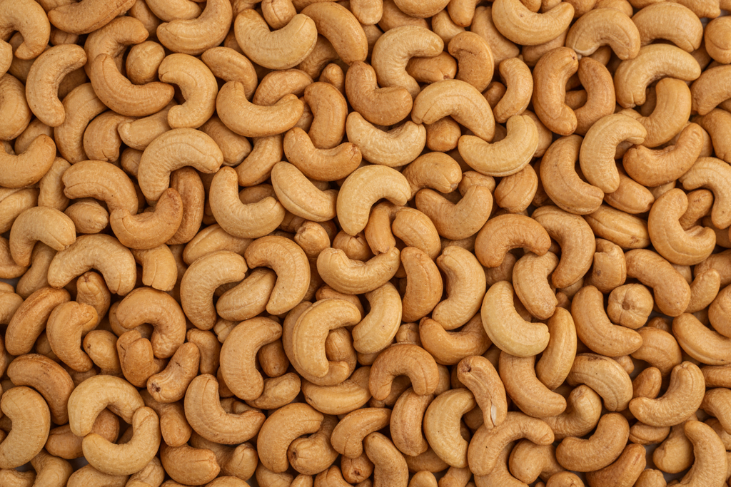 ROASTED UNSALTED CASHEWS FROM BIRDS EYE VEIW FILLING THE WHOLE IMAGE