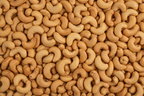 ROASTED UNSALTED CASHEWS FROM BIRDS EYE VEIW FILLING THE WHOLE IMAGE